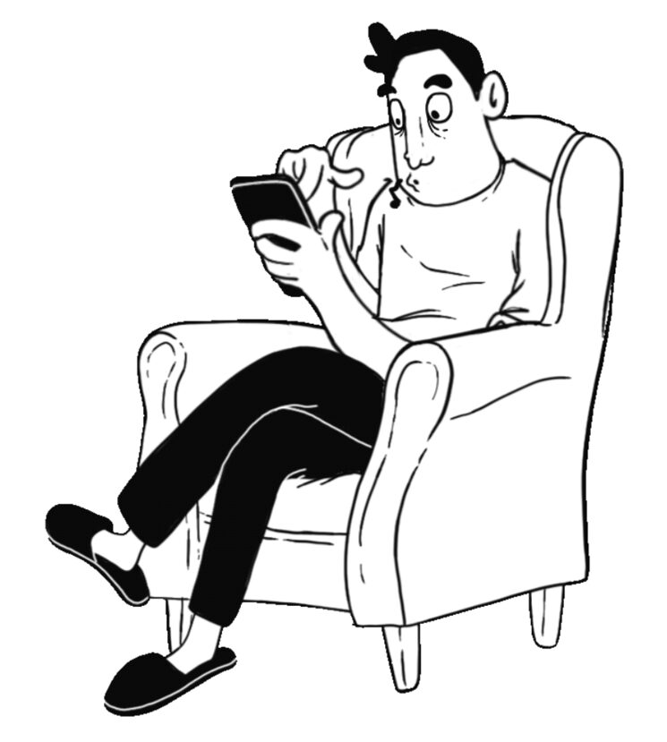 En Carles al seu hàbitat natural, al sofà amb el mòbil a la mà