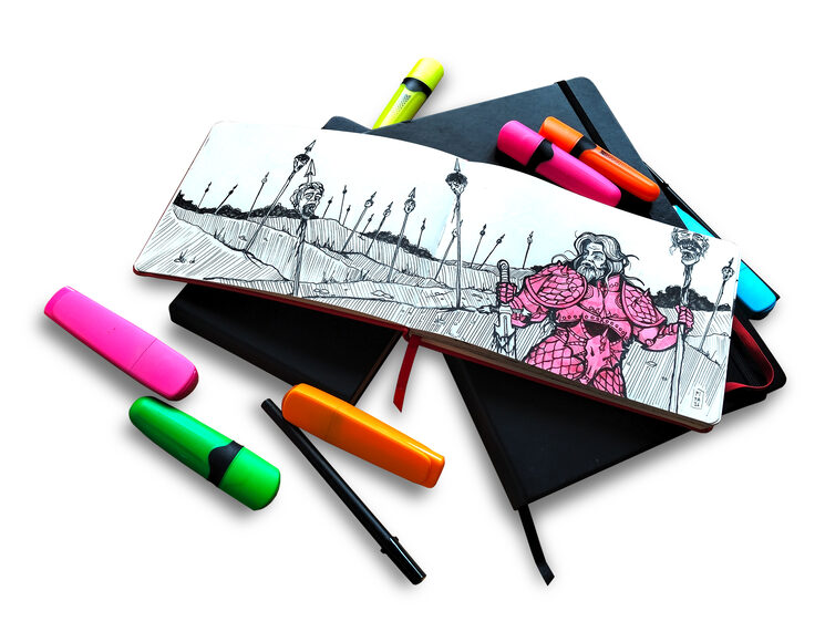 Cuaderno de bocetos y rotuladores
